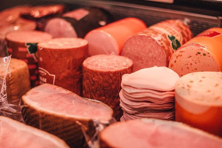 many different types of meats are stacked together