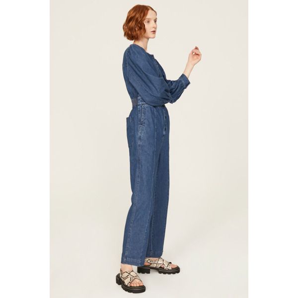 Blue denim (76% Cotton, 21% Hemp, 3% Elastane). Jumpsuit. Long sleeves. Crewneck. 29" inseam. 12" rise. Imported. Medium Wash Relaxed Fit Overalls For Work, Relaxed Fit Medium Wash Overalls For Work, Medium Wash Overall Jeans For Work, Casual Workwear Washed Blue Denim Jumpsuit, Casual Washed Blue Denim Jumpsuit For Work, Spring Workwear Medium Wash Overalls, Blue Denim Jumpsuit For Work In Spring, Blue Denim Jumpsuit For Spring Workwear, Spring Washed Blue Straight Leg Denim Jumpsuit