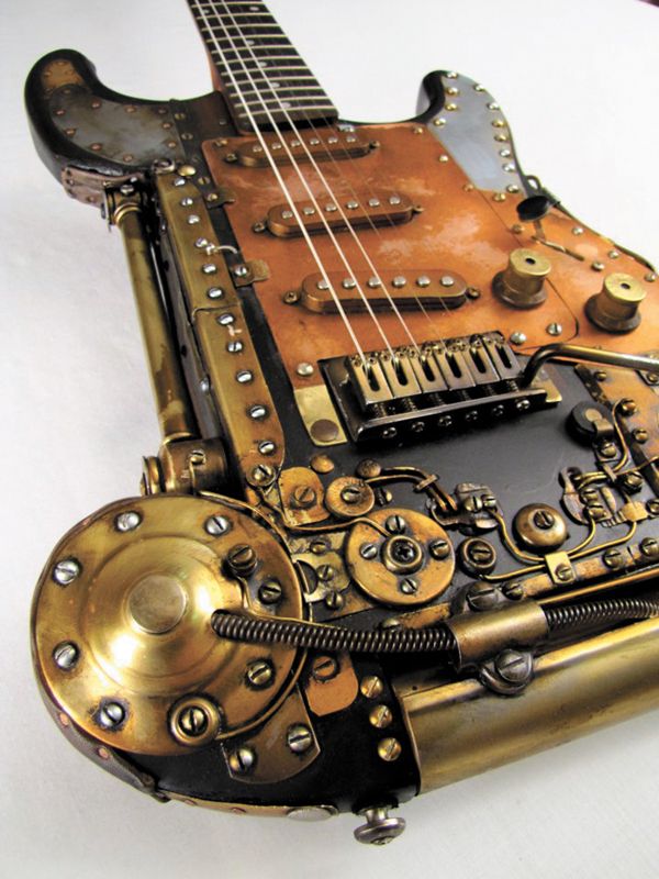 an old steampunk guitar is sitting on the table