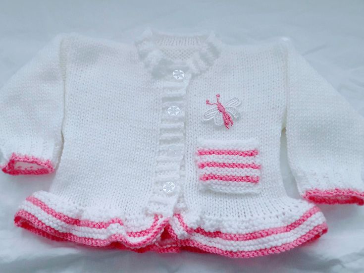 cute knitted baby girls cardigan is the perfect little girls outfit, it matches perfectly with all your other baby clothes, jeans, dresses & leggings and has been a very popular choice  This knitted baby girl Jacket also makes a great gift for new moms, a beautiful coming home baby outfit or to give as a baby shower gift Girls holiday sweater, Girls Christmas sweater or Little girl wedding clothes All my baby knitwear is hand knitted in soft acrylic baby yarn the main colour is silver and you ca Cute Fitted White Sweater, White Fitted Cute Sweater, Winter Hand Knitted White Top, Hand Knitted White Winter Top, Winter White Hand Knitted Top, Cute Fitted Cardigan For Autumn, Cute Fitted Sweater For Fall, Cute Fitted Fall Cardigan, Fitted Pink Cute Sweater