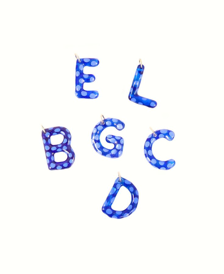 the letters are made up of blue glass beads and silver earwires, which spell out the word abc