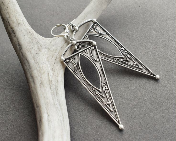 Boho Triangle Earrings: Beautiful, bold, and totally versatile, these silver-tone dangle earrings are equally suited to a music festival or a downtown cafe. They'll make you feel like the goddess you are! ✧ 3.25 inches long ✧ Comfortably lightweight at 5 grams each (same as a US nickel) ✧ Nickel-free/lead-free silver-tone dangles ✧ Lever-back hooks in your choice of silver-plated, stainless steel, or sterling silver ✧ Gift-ready in attractive, earth friendly box ✧ Handmade just for you, ready to Earrings Long Silver, Earrings Triangle, Long Silver Earrings, Silver Statement Earrings, Festival Jewelry, Earrings Bohemian, Triangle Earrings, Silver Gifts, Metal Earrings