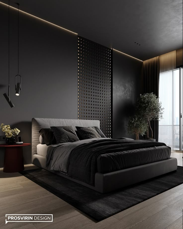 a bedroom with black walls and wooden flooring has a large bed in the middle