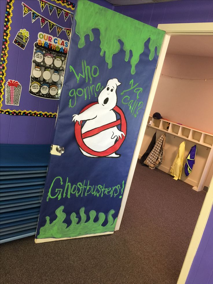 a classroom door decorated with ghostbuster's sign and other halloween decorations on the wall