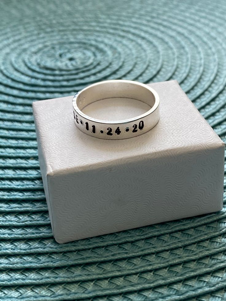 Sterling silver memorial ring personalized with a name, date of passing, inspirational phrase- perfect remembrance gift for men and women to honor a loved one. - Sterling silver, hand stamped band measures 6mm. - Personalize with up to 30 characters. -Hand stamped rings will stretch slightly when stamped, so more letters = more stretching. HOW TO ORDER: 1. Select Your Drop Downs. 2. Add to cart. 3. Leave me a note in the message to seller during checkout with your personalization up to 30 charac Hand Stamped Ring For Anniversary, Personalized Silver Engraved Ring For Mother's Day, Sterling Silver Engraved Name Ring For Anniversary, Customizable Silver Engraved Ring For Mother's Day, Personalized Silver Rings For Anniversary, Meaningful Engraved Rings For Anniversary, Classic Hand Stamped Rings For Anniversary, Classic Custom Name Rings For Anniversary, Classic Hand Stamped Anniversary Rings