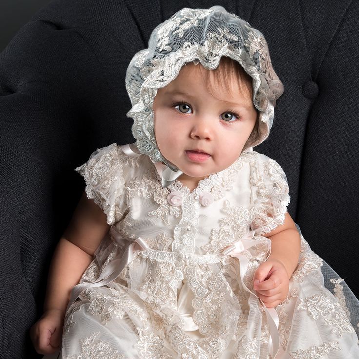 Handmade in the USA This girls Baptism gown is so gorgeous and so detailed, it's not a stretch to say that it is truly a work of art. The lace overlay on this baptism gown is both stunning and special, made of embroidered netting with a rich floral design featuring embroidered flowers in a pretty shade of ivory with champagne cording, adding depth and richness. Trimmed in ivory Venice edging and long ivory or pink silk ribbon bows flowing down the skirt. Includes the matching lace bonnet. This b Baptism Gown Girl, Lace Bonnet, Lace Coat, Baptism Gown, Silk Dupioni, Baby Swing, Baptism Outfit, Christening Gown