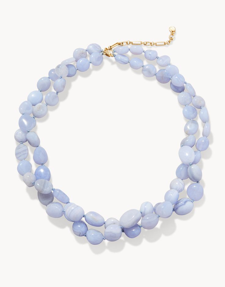 Inspired by the tranquil tidal saltwater of the May River, The Bluff Necklace is layered in Blue Chalcedony beads on soft blue rope. Please note: This design features natural stones and each piece is one-of-a-kind. Colors and patterns may vary slightly from the image shown. Blue Chalcedony Bead Necklaces, Blue Chalcedony Round Beads Necklace, Blue Chalcedony Gemstone Bead Necklaces, Blue Beaded Chalcedony Necklace, Blue Agate Polished Bead Necklaces, Blue Agate Beaded Necklace With Polished Beads, Adjustable Light Blue Necklaces With Natural Stones, Blue Agate Polished Beads Necklace, Blue Double Strand Natural Stones Jewelry