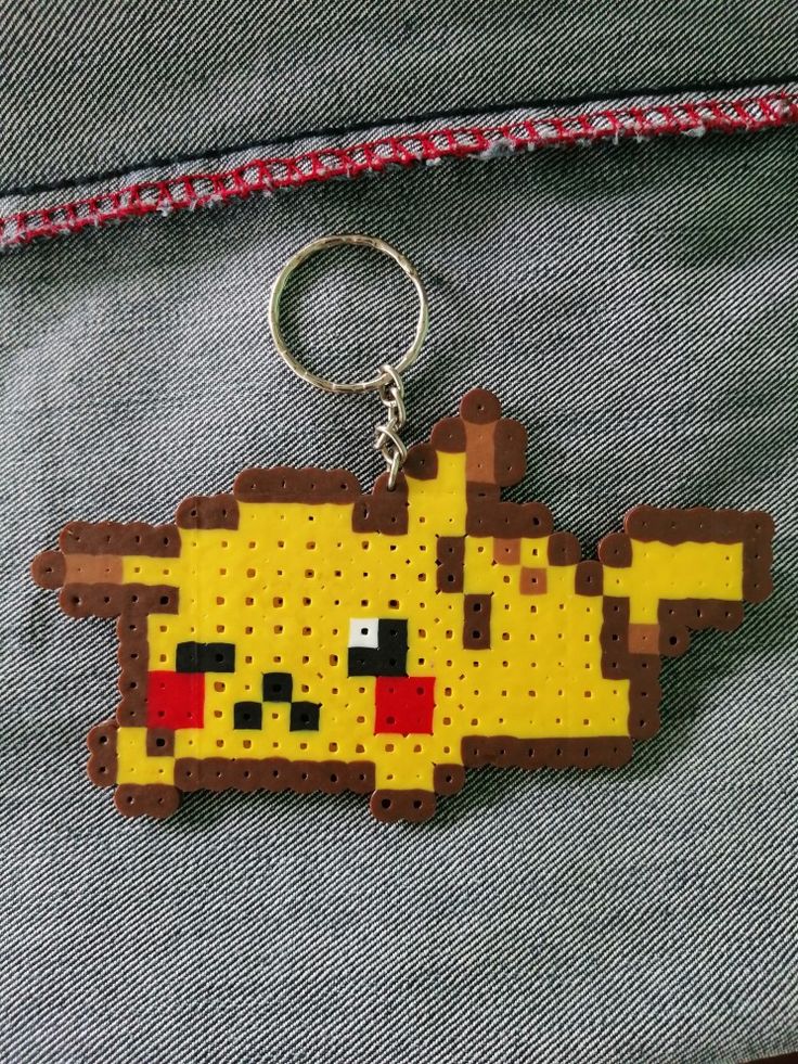 a keychain made out of perler beads with a pokemon pikachu on it