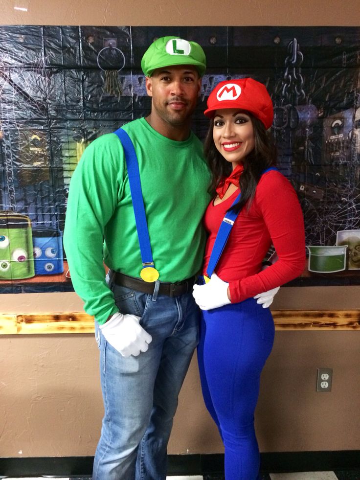 a man and woman dressed up as mario and luigi