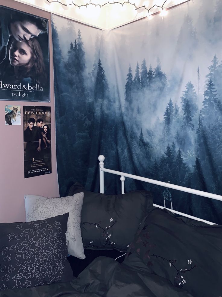 there is a bed with black sheets and pillows in front of a twilight movie poster on the wall