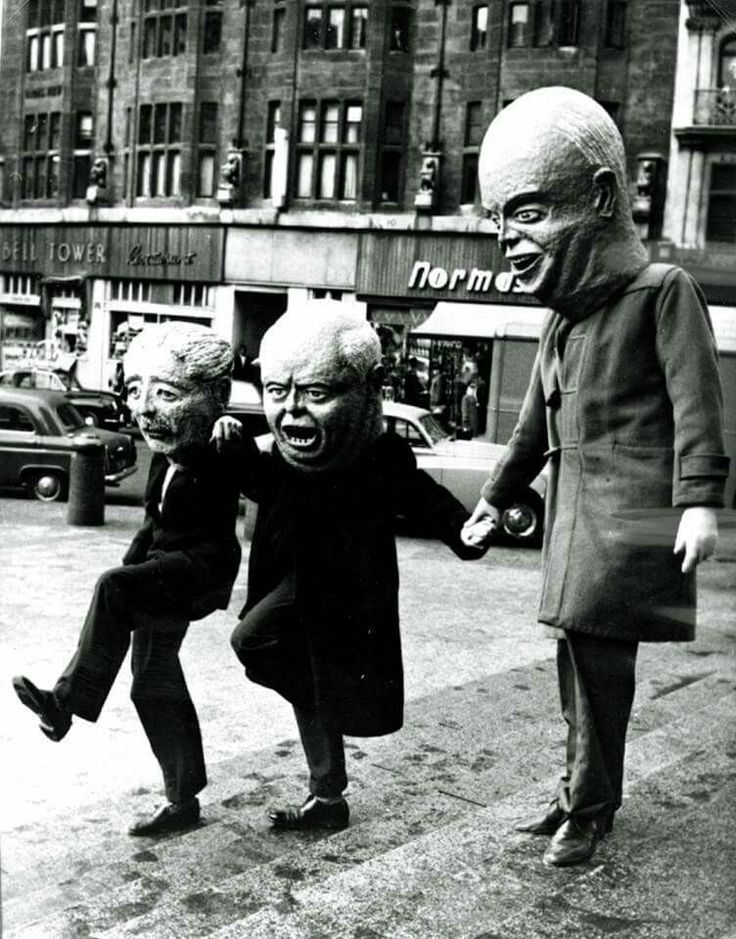 an old black and white photo of two children holding hands with the statue of abraham lincoln