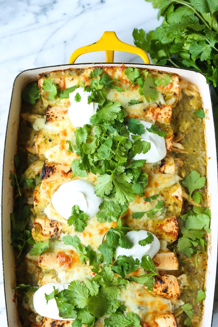 chicken enchilada casserole with sour cream sauce and cilantro