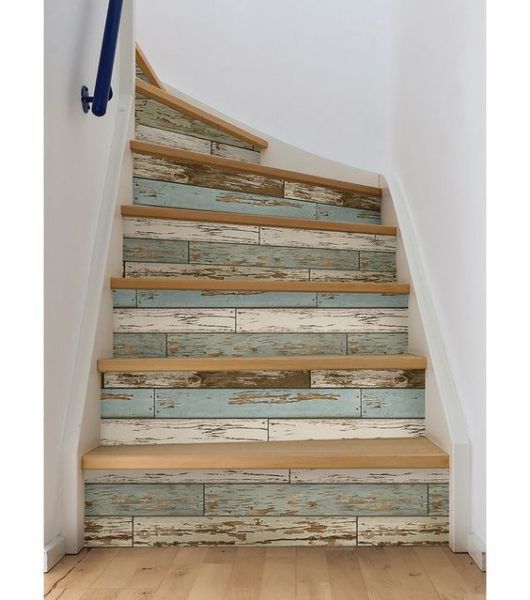 the stairs are painted with blue and white wood planks as well as wooden flooring