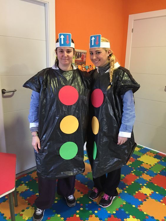 two people dressed up in costumes made to look like they are standing next to each other