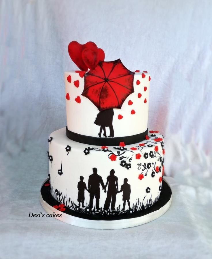 a three tiered cake decorated with an umbrella and silhouettes of people holding hands