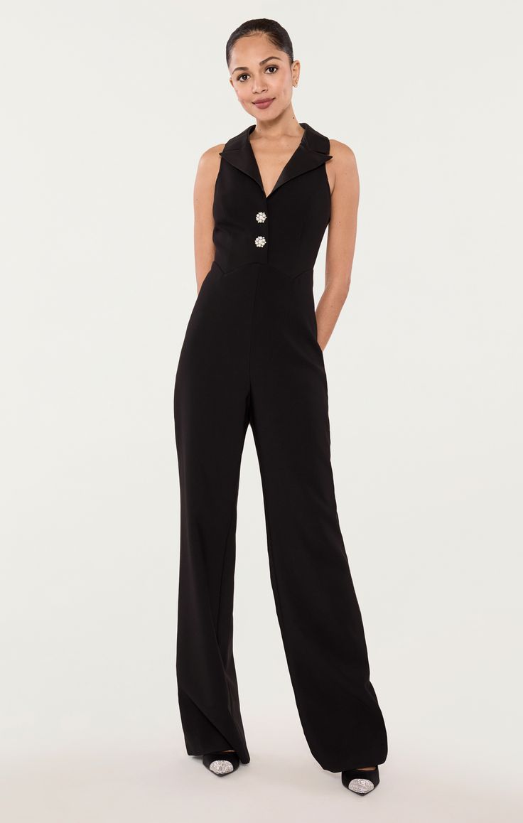 Look classic and chic in this formal Rivington Jumpsuit, featuring a stylish collared neckline and button up detail. Make a bold statement at any event for a stunning and elegant look! Fit Details Fitted silhouetteUnlinedSleevelessHidden side zipper & front button closureFull length96% Polyester 4% SpandexDry Clean Only ImportedMeasurementsLength: 59.5in/151.13cm, from shoulder to hemMeasurements from size 4 Button Up Jumpsuit, Black Sleeveless Jumpsuit, Fit Details, Sleeveless Jumpsuits, Measurement Length, Front Zipper, Side Zipper, All Black, Jumpsuit Romper