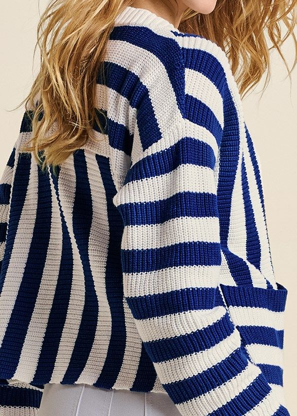 Layer on this long-sleeve cardigan for a day of spontaneous fun! Secured at the front by three buttons below the deep V-neck, this striped sweater’s cropped silhouette assures a relaxed fit for casual days. Ribbed trim at the edges and patch pockets at the hips make this an easy-to wear piece. Oversized Striped Long Sleeve Cardigan, Trendy Oversized Striped Cardigan, Striped Oversized Cardigan For Spring, Oversized Striped Cardigan For Spring, Spring Sweater With Contrast Stripes, Striped Long Sleeve Cropped Sweater For Spring, Spring Knit Sweater With Contrast Stripes, Knit Sweater With Contrast Stripes For Spring, Trendy Striped Long Sleeve Cardigan