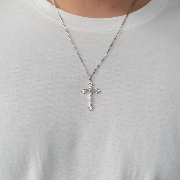 This stylized cross necklace makes for the perfect gift to your love one, or yourself! Simple yet elegant, this everyday piece is guaranteed to elevate your outfit. Silver Cross Necklace For Men, Mens Cross Necklace Silver, Silver Cross Necklace For Streetwear, Stainless Steel Cross Necklaces For Streetwear, Cross Necklace For Men, Men’s Crucifix Necklace, Elevate Your Outfit, Initial Earrings Studs, Arabic Jewelry