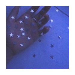 a person's hand with stars painted on it