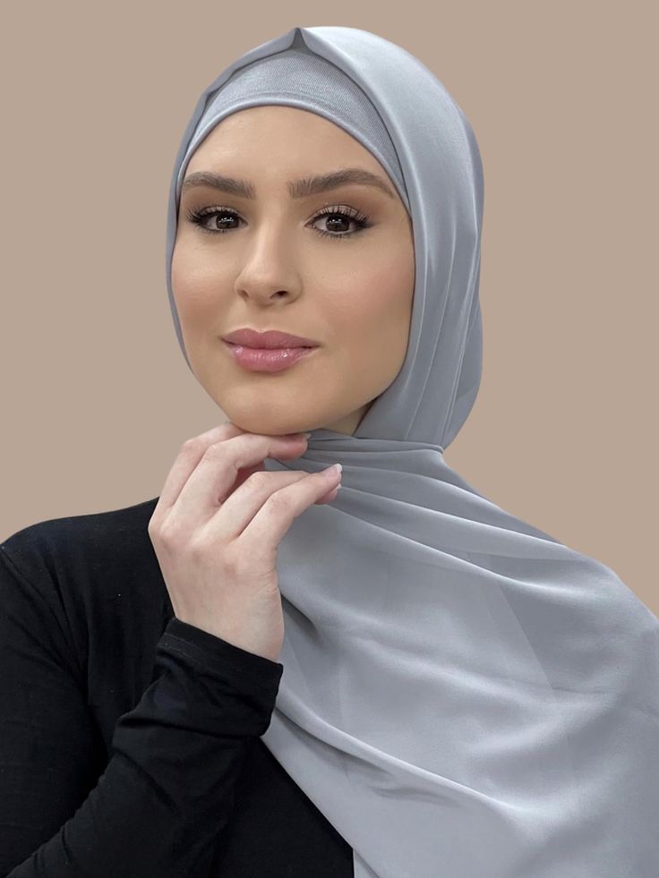 Our Luxury Chiffon Hijab-Chic Grey is perfect for every occasion. With the softest chiffon fabric we could find, our Luxury Chiffon will become your go to hijab whether you're going out to a fancy party or keeping it casual, looking beautiful is effortless! If you're looking for the perfect hijab and under scarf match for this color. We have paired it for you with our Premium Jersey Under scarf Chic Grey (Sold Separately) Fabric: Polyester Chiffon Dimension: 70" x 27" Contour: Long Rectangle Thi Elegant Chiffon Headscarf For Eid, Elegant Chiffon Headscarf, Modest Chiffon Hijab For Eid, Elegant Chiffon Khimar For Eid, Hijab And Cap, Under Scarf, Chiffon Hijab, Muslim Girl, Hijab Chic