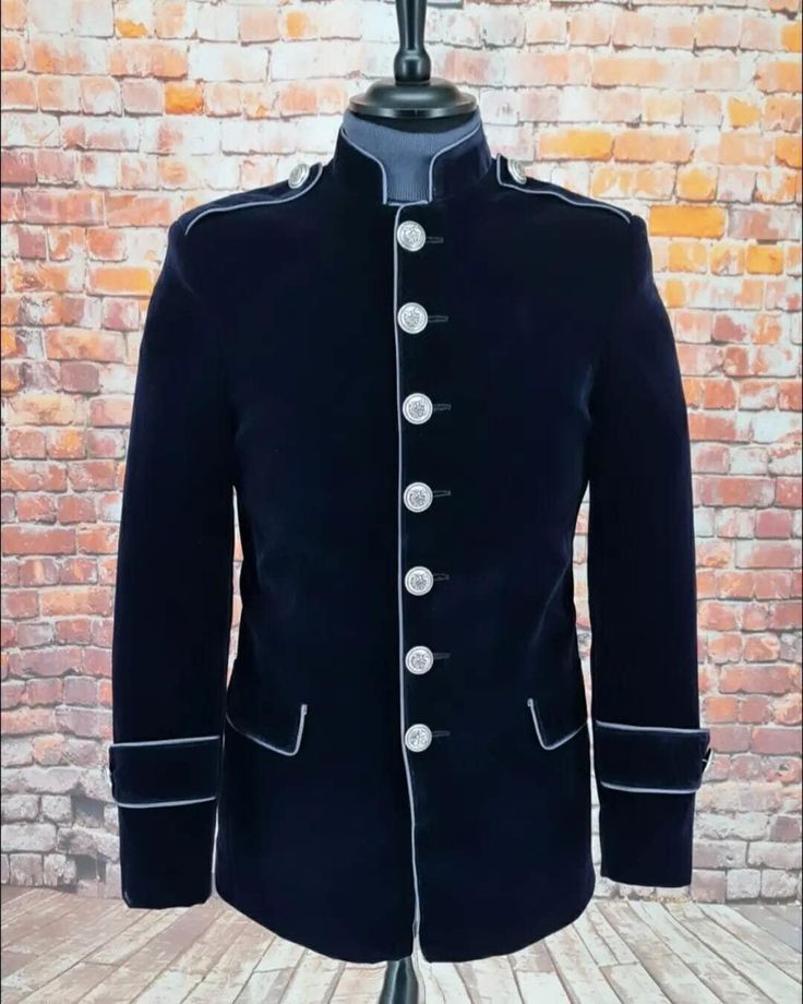 From us here at Modclothin Crown & Jester we have the stunning A military inspired late 60s look. Beautifully crafted from a fine quality Navy velvet, piped in Silver. Fitted with a quirky London lining this beauty is sure to turn a few heads. Nehru collar Navy velvet Silver piping Two Piped front lower front pockets Three inside pockets Three length options Quirky lining Three inside pockets Spare buttons          *THESE JACKETS ARE MADE TO ORDER ONLY AND TAKE BETWEEN 3 TO 4 WEEKS Formal Fitted Blazer With Epaulettes, Classic Fitted Sport Coat With Stand Collar, Fitted Classic Sport Coat With Stand Collar, Fitted Nehru Jacket With Stand Collar For Fall, Classic Fitted Nehru Jacket With Stand Collar, Retro Fitted Sport Coat With Buttons, Fitted Nehru Jacket With Stand Collar For Winter, Fitted Nehru Jacket With Button Closure For Winter, Retro Fitted Sport Coat