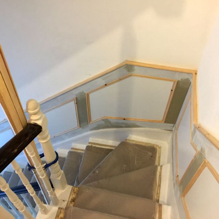 an overhead view of a stair case in a house with unfinished walls and carpet on the floor