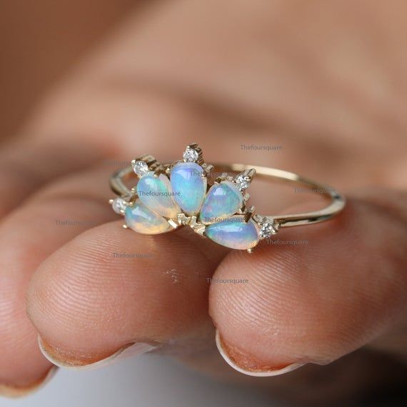 14K Gold Pear Opal Ring, Dainty Wedding Gemstone Band Ring, Stacking Engagement Ring, Gemstone Ring For Her, Diamond Ring, Pear Tiara Ring, Gemstone Band RingProduct info:14k solid goldnatural diamond - white diamondwhite diamonds, I color, SI claritywhite diamonds - 0.05 ct, I, SI clarityOpal :0.65 ct, NaturalRing Size 7Item will be resized and shipped within 10 days.ITEM Will BE SHIPPED : India Speed PostTo get the item in 4-5 days, we can also ship it thru DHL express, please contact us befor Cluster Gemstone Diamond Ring For Wedding, Gold Cluster Birthstone Ring For Wedding, Gold Multi-stone Rings For Wedding, Cluster Diamond Ring With Accent Stones For Wedding, Wedding Cluster Diamond Ring With Gemstone, Wedding Diamond Ring With Cluster Accent Stones, Gold Opal Wedding Jewelry, Wedding Cluster Diamond Ring With Accent Stones, Yellow Gold Opal Ring With 17 Jewels For Wedding