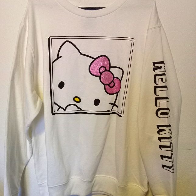 This Is An Original Sanrio Hello Kitty White Sweatshirt Pullover. Size Xl Cotton, Polyester New Hello Kitty Crew Neck Fun Tops, Hello Kitty Fun Crew Neck Top, Hello Kitty Print Crew Neck Cotton Sweatshirt, Trendy Hello Kitty Cotton Sweatshirt, Trendy Cotton Sweatshirt With Hello Kitty Print, Cotton Crew Neck Sweatshirt With Hello Kitty Print, Cute Cotton Sweatshirt With Hello Kitty Print, Casual Cotton Sweatshirt With Hello Kitty Print, Casual Long Sleeve Hello Kitty T-shirt