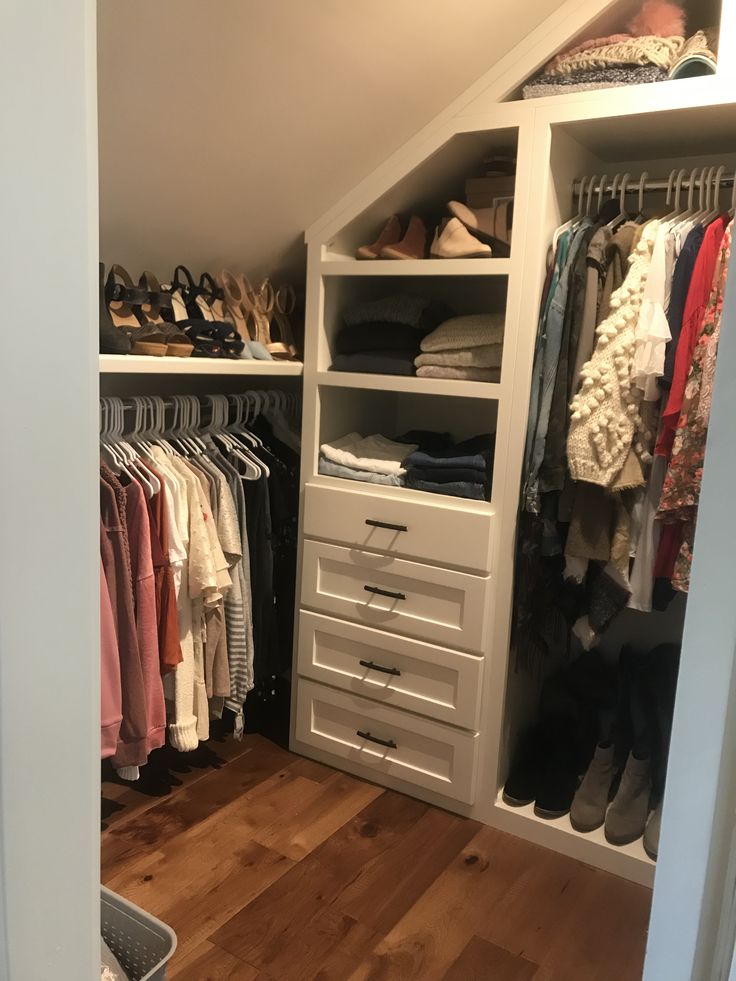 the closet is full of clothes and shoes