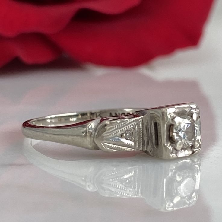 Details: Sweet classic Art Deco diamond ring--this one would make a great engagement ring or just a sweet ring to add to a collection. Would also be a great pinky ring! Please ask all necessary questions prior to placing an order. Measurements: The size is 4 1/2 US, and can be sized for a fee. Condition: The overall all condition of this ring is very good. Diamond White Emerald Cut Cluster Ring For Anniversary, Classic Formal Diamond Ring With Round Band, Formal Single Diamond Ring, Classic Emerald Cut Diamond Cluster Ring, Classic Diamond Cluster Ring With Emerald Cut, Vintage Engraved Ring With Single Diamond For Anniversary, 14k White Gold Formal Wedding Ring With Asscher Cut, Formal 14k White Gold Wedding Ring With Asscher Cut, 14k White Gold Emerald Cut Promise Diamond Ring