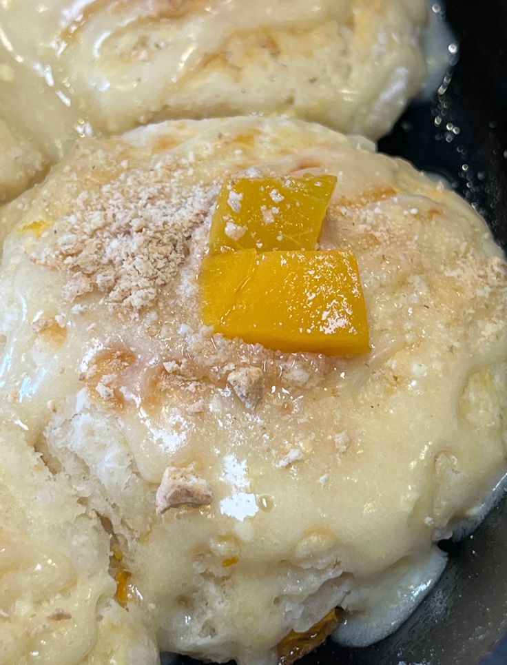 some food is cooking in a pan on the stove top and ready to be eaten