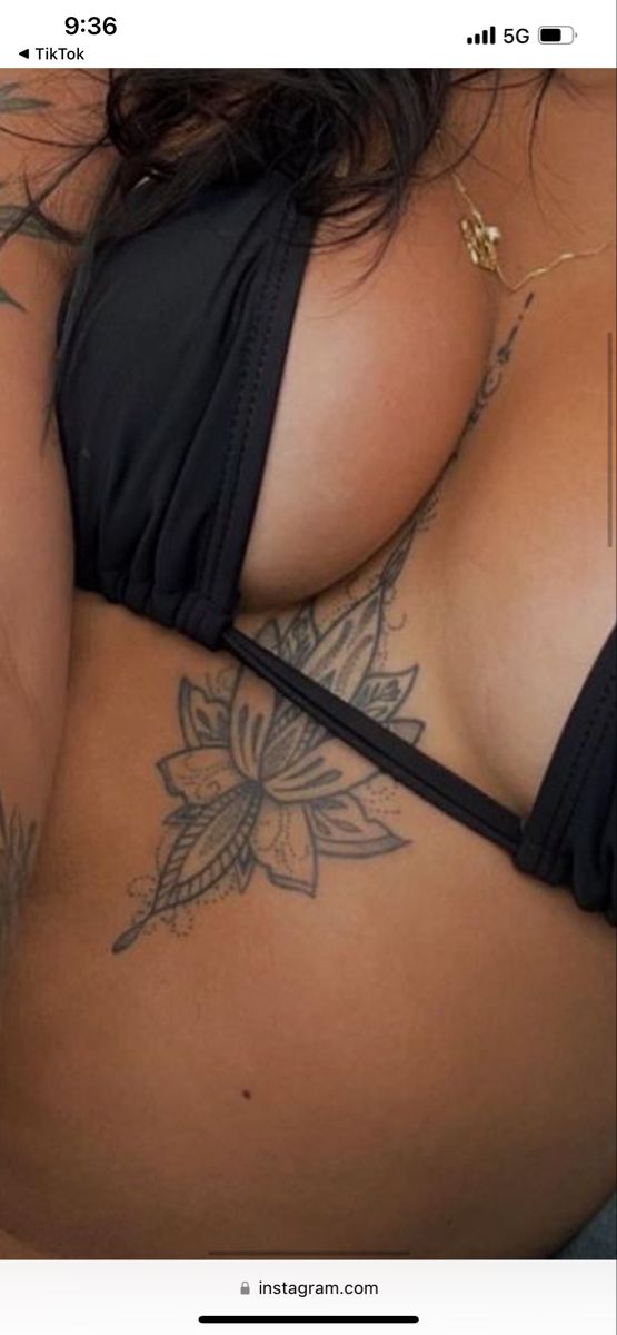 an image of a woman with tattoos on her stomach