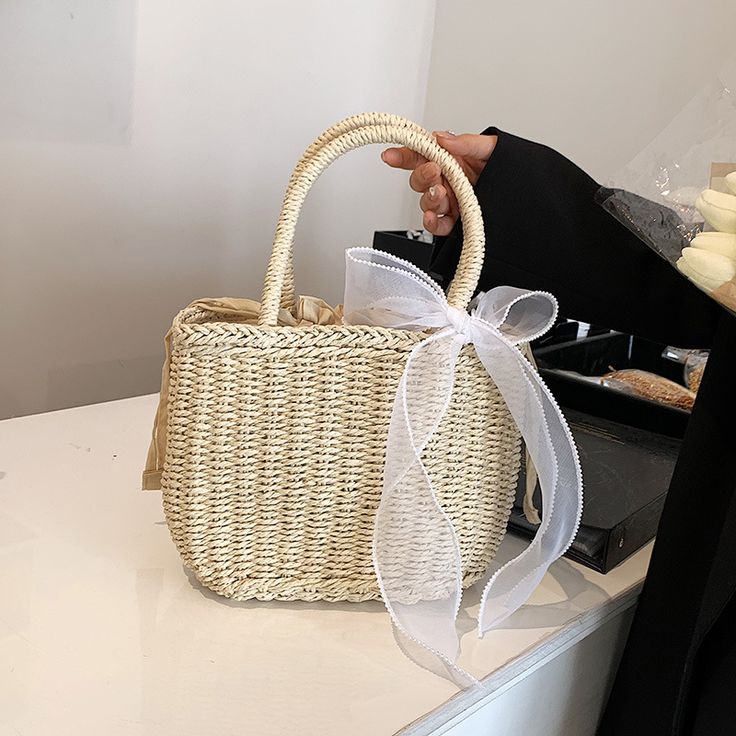 Place Of Origin : SHAN DONG Province Place Of Origin : SHAN DONG Province Occasion : Versatile Exterior : none Interior : No Pocket Hardness : HARD Closure Type : string Pattern Type : Knitting Gender : WOMEN Style : Bohemian Decoration : none Lining Material : POLYESTER Main Material : Straw Shape : Casual Tote Brand Name : Yogodlns CN : Shandong WHAT ABOUT REFUND?   Fast refund,100% Money Back Guarantee. If your product is defective or doesnt work properly, let us know and well send you a repl Weaving Bag, Woven Beach Bag, Bohemian Decoration, Straw Weaving, Water Bucket, Basket Tote, Butterfly Knot, Straw Handbags, Rattan Bag