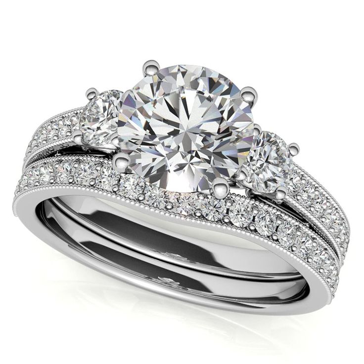 a diamond engagement ring set with two matching bands