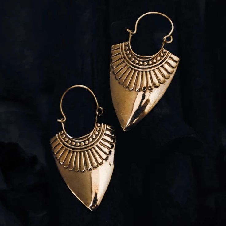 Shield Earrings handcrafted in India. Nickel Free Handcrafted with brass Ships out within 3–5 business days TRIBAL DESERT Ceremonial Brass Drop Earrings, Unique Brass Single Cartilage Earring, Ceremonial Pierced Brass Jewelry, Ceremonial Pierced Brass Earrings, Ceremonial Brass Earrings, Brass Drop Earrings For Festivals, Gold Colored Copper Earrings For Festivals, Unique Ceremonial Brass Earrings, Ceremonial Brass Jewelry For Pierced Ears