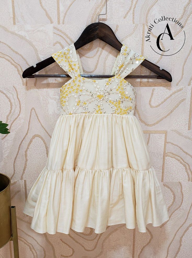 Material: Soft cotton with georgette Frock Length: 23 inches. Chest Size: 20 inches. Waist Size: 19 inches. Festive Yellow Ruffled Dress, Festive Sleeveless Dress With Ruffles, Sleeveless Dress For Festive Dress-up, Festive Sleeveless Dress For Dress-up, Festive Sleeveless Dress-up Dresses, Cotton Summer Dress-up Sets, Summer Cotton Sets For Dress-up, Summer Cotton Dress-up Sets, Festive Cotton Dresses For Spring