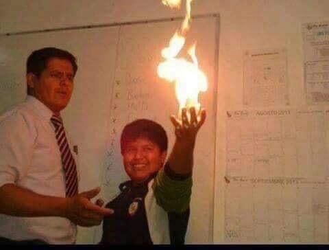 two men standing next to each other in front of a whiteboard