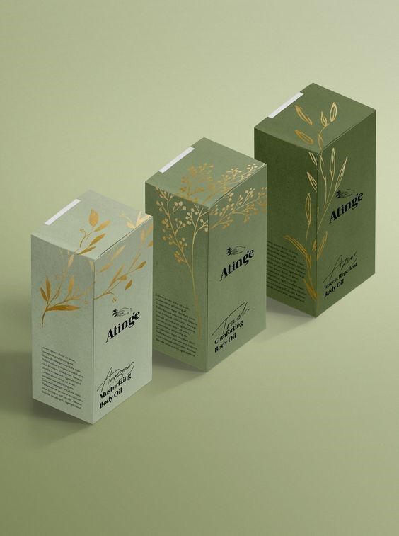 three boxes that are designed to look like tea bags with gold foiling on them