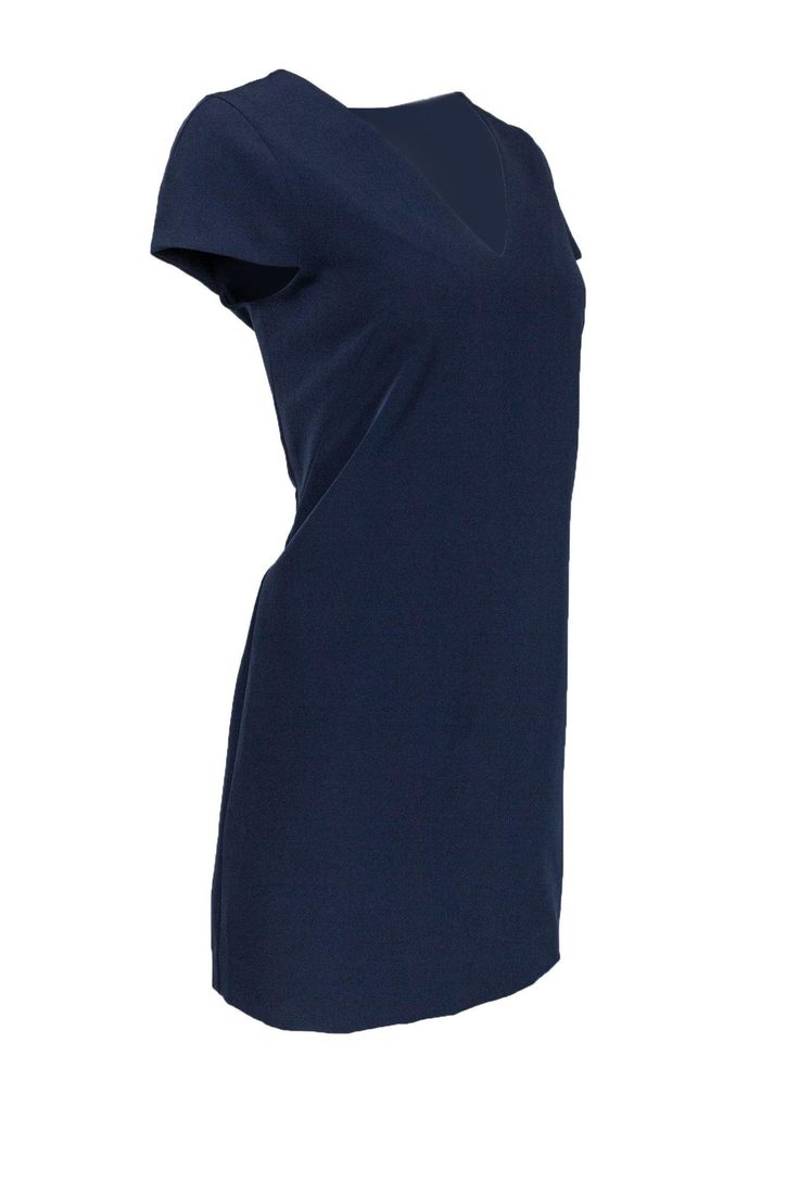 Whether it’s evening cocktails or a work lunch, this Milly dress has got you covered. With a feminine V-neck and cap sleeves, dress it up with sparkling jewelry or keep it casual with only a few delicate necklaces. The versatility within this piece is perfect for the busy woman. Size 8 Shell: 90% Polyester, 10% Elastane Lining: 100% Polyester Made in USA Concealed back zipper Lined Shift silhouette V-neckline Cap sleeve Bust 38” Shoulder to hem 33.5” Elegant Short Sleeve V-neck Dress For Date Night, Chic V-neck Short Sleeve Evening Dress, Chic Navy V-neck Mini Dress, Elegant V-neck Dress With Notched Neckline For Night Out, Elegant Blue V-neck Dress For Date Night, Blue V-neck Midi Dress For Work, Blue V-neck Dress For Work, Elegant Blue Sleeveless V-neck Dress, Chic Navy V-neck Dress