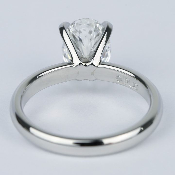 a white gold engagement ring with a princess cut diamond