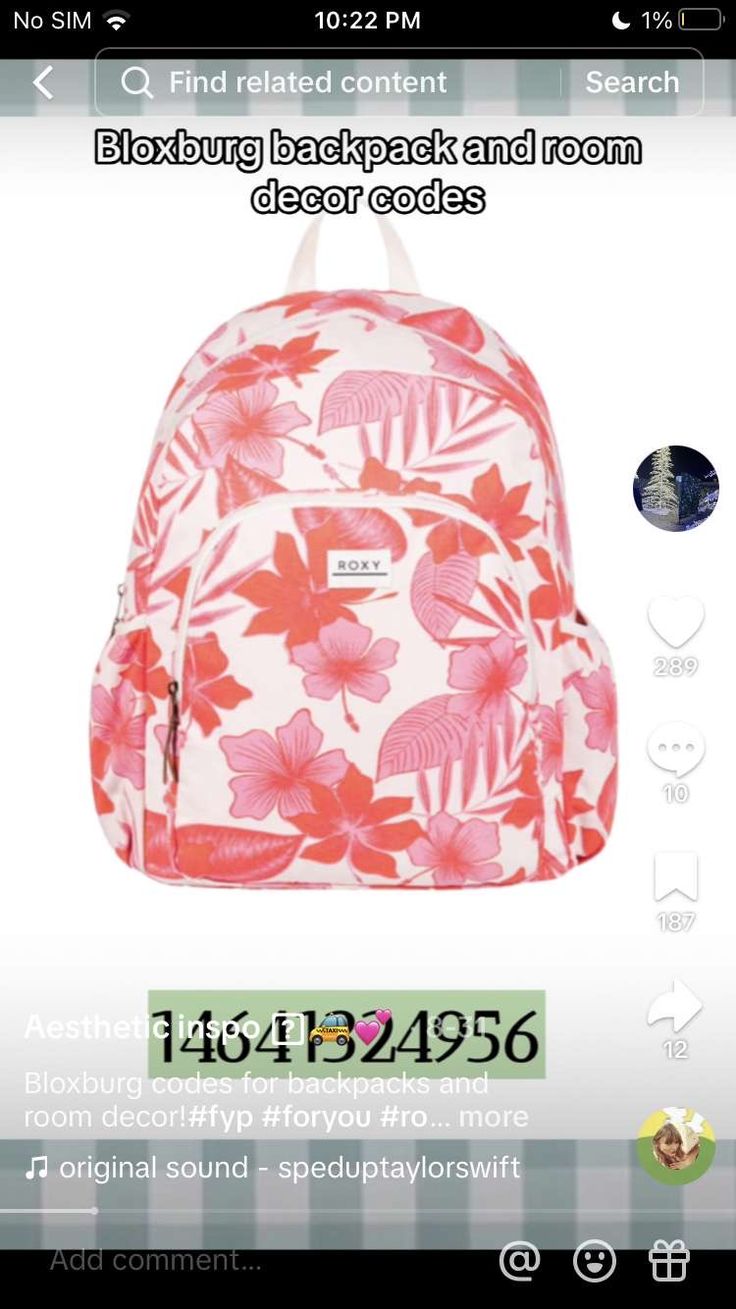 the back pack is pink and white with flowers on it