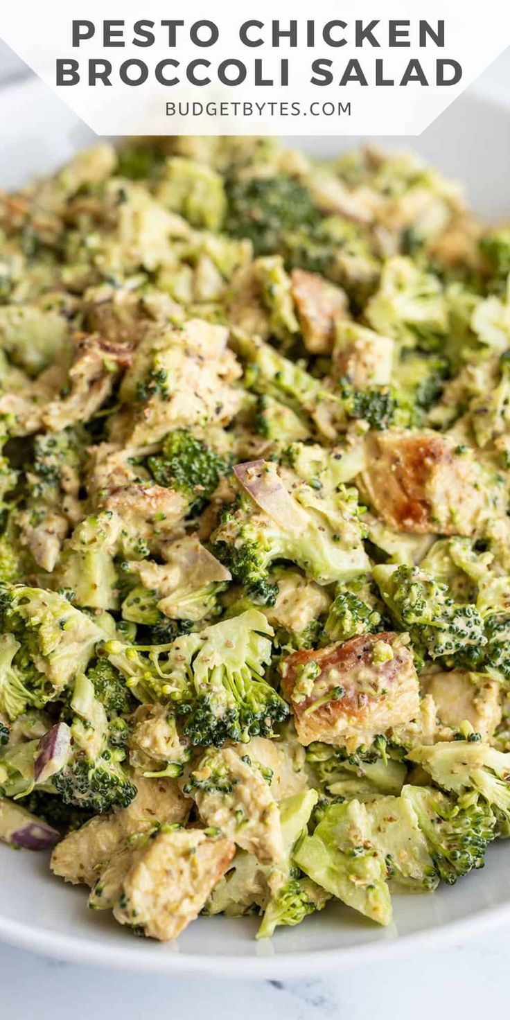 a white bowl filled with broccoli salad on top of a table