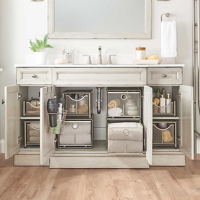 a bathroom with white walls and wooden flooring, including an open cabinet to the toilet