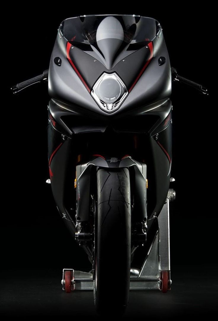 the front end of a motorcycle on a black background