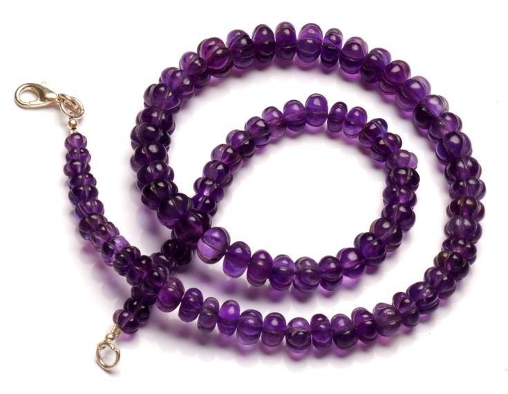 Enhance your jewelry collection with this exquisite Natural Amethyst Gemstone. The gemstone boasts a beautiful Muskmelon Beads shape, carved to perfection with a size of 6 to 9 mm. The translucent purple color adds a touch of elegance to any outfit, making it perfect for both casual and formal occasions. This 184 Cts. gemstone has a rich history, originating from India and Brazil. The gemstone's natural creation adds to its unique charm and makes it a must-have for gemstone enthusiasts. The 17-i Amethyst Gemstone Beaded Necklaces, Single Strand Amethyst Beaded Jewelry, Single Strand Amethyst Bead Jewelry, Round Amethyst Beaded Necklace With Polished Beads, Amethyst Single Strand Jewelry With Round Beads, Amethyst Rondelle Gemstone Beads, Purple Hand-strung Necklaces, Rondelle Amethyst Gemstone Beads, Hand-strung Amethyst Round Bead Jewelry