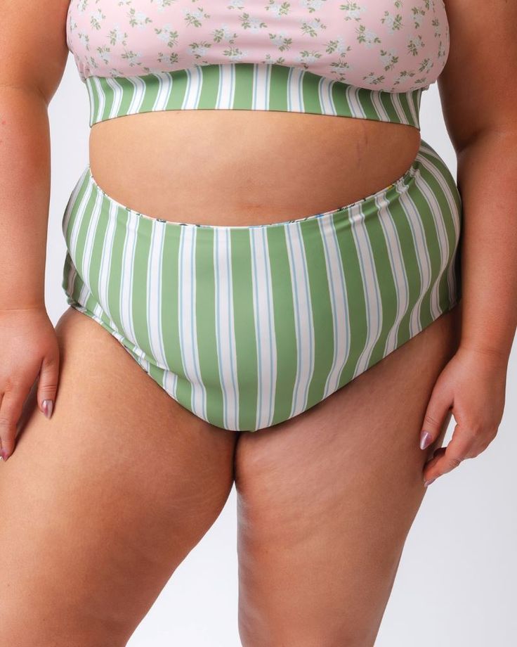 Try our best-selling bottom in Somerset Floral and Basil Stripe! Featuring an ultra high waistline and seamless construction, you'll want to grab a pair or two of these reversible bottoms, and mix & match them to make a set. You'll notice the inside print peeking out when worn reversed, but don't be alarmed; that's the nature of reversible items. Plus, we think it's a fun contrasting trim to compliment the bottoms and tops as well! Available in XXS-4X82% nylon, 18% spandexProvides UV 50+ protect Short One Piece, Contrasting Trim, Skirt Jumpsuit, Swim Skirt, Resort Collection, High Waist Bottoms, Swim Bottoms, Tankini Top