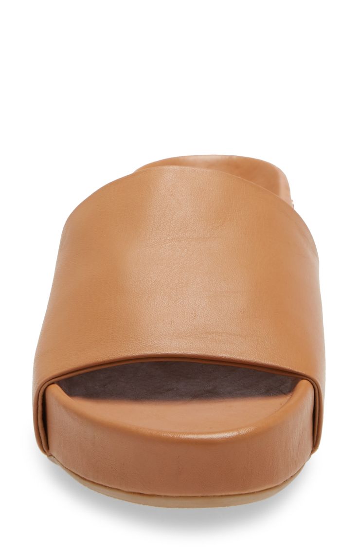 Smooth vegetable-tanned leather elevates a contemporary slide sandal that holds your foot in comfort with a molded footbed and sits on a flexible rubber sole. 1 3/4" heel; 1 1/4" platform (size 11) Cushioned EVA footbed with arch support Leather upper and lining/rubber sole Imported Women's Shoes With every shoe purchased, Beek will donate a meal to a child in need through multiple outside charities Platform Slides, Children In Need, Sandal Women, Vegetable Tanned Leather, Women Style, Slide Sandals, Sunglasses Case, Rubber Sole, Womens Sandals