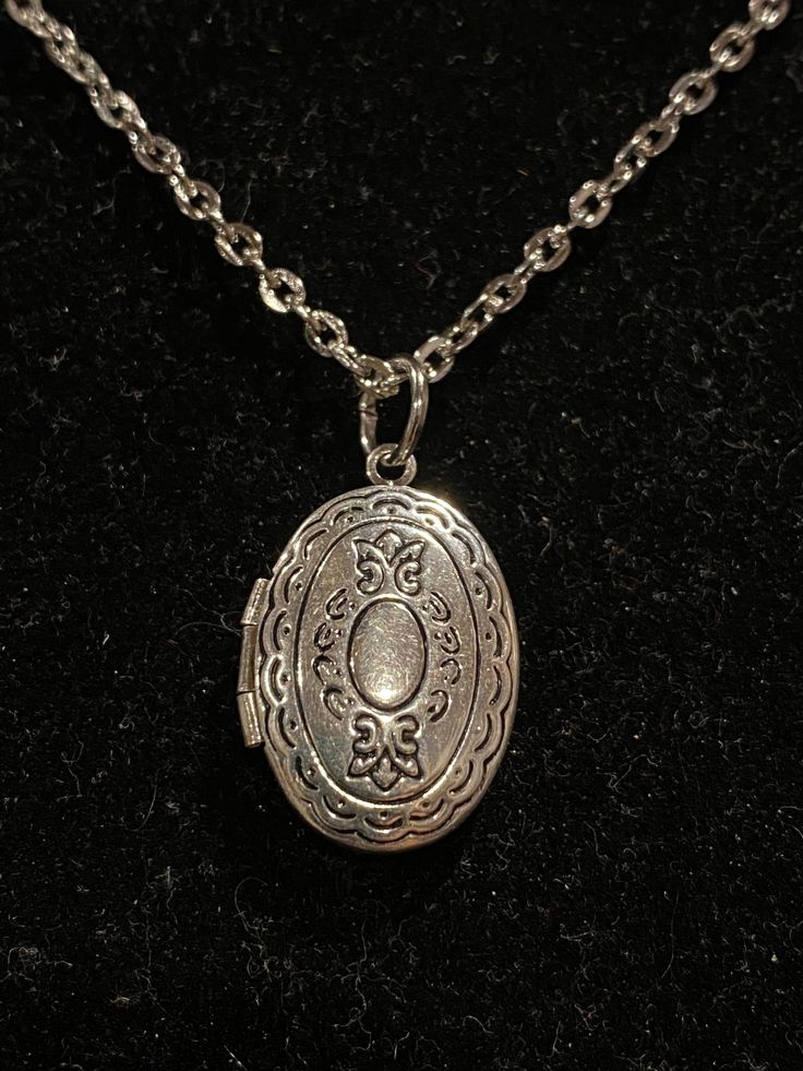 Necklace is silver in color Measures 18 inches in length Locket measures 1 inch in length and .75 inches in width Necklace is made with alloy metal Locket is lightweight because of the alloy metal Oval Locket Necklace, Silver Locket Necklace, Oval Locket, Silver Locket, Funky Jewelry, Fantasy Jewelry, Dream Jewelry, Locket Necklace, Exquisite Jewelry