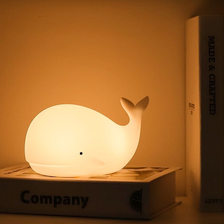 a whale lamp sitting on top of a box