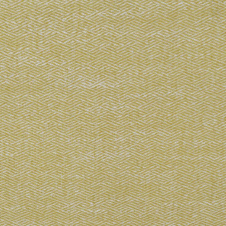 an upholstered yellow and white textured fabric